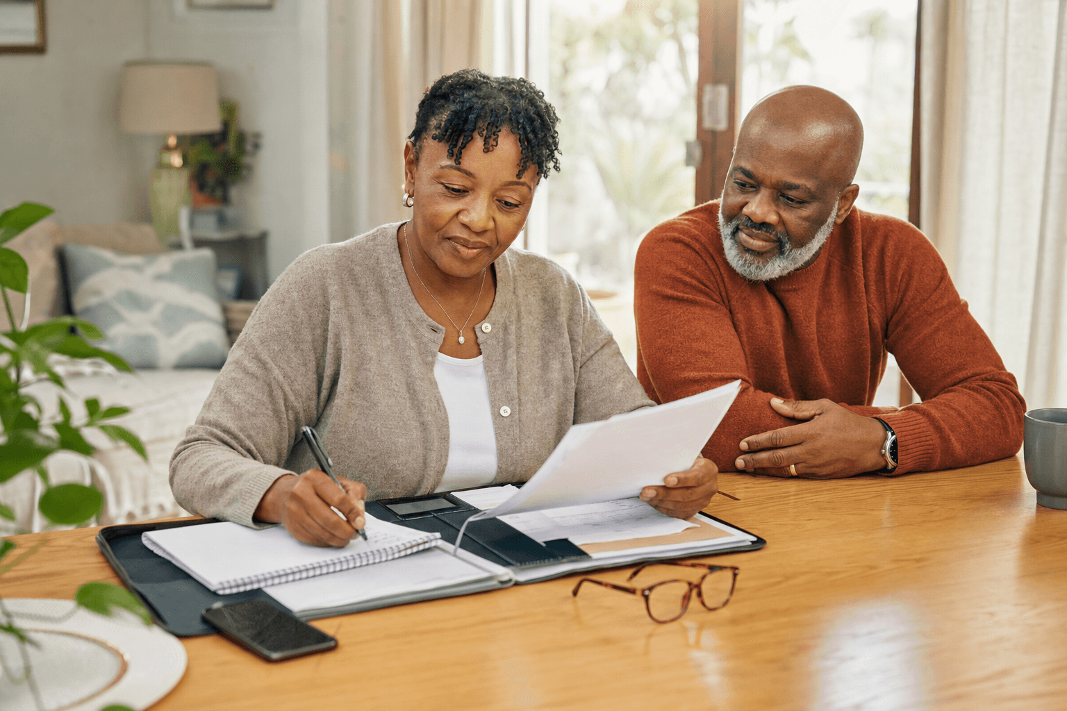 A patient organizing documents and questions before an appointment