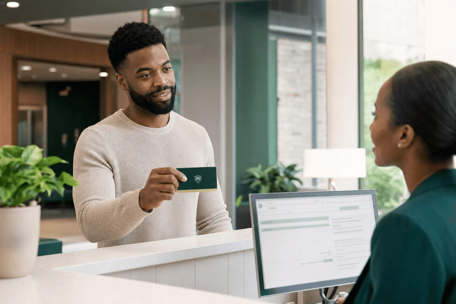 A patient presenting a medical membership card at hospital reception